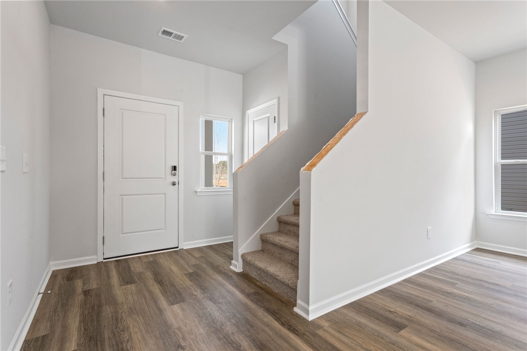 146 Cedar Shoals Easley, SC 29640 - Photo 5 of 34 This bright entrance foyer welcomes you with elegant flooring and a well-designed staircase.