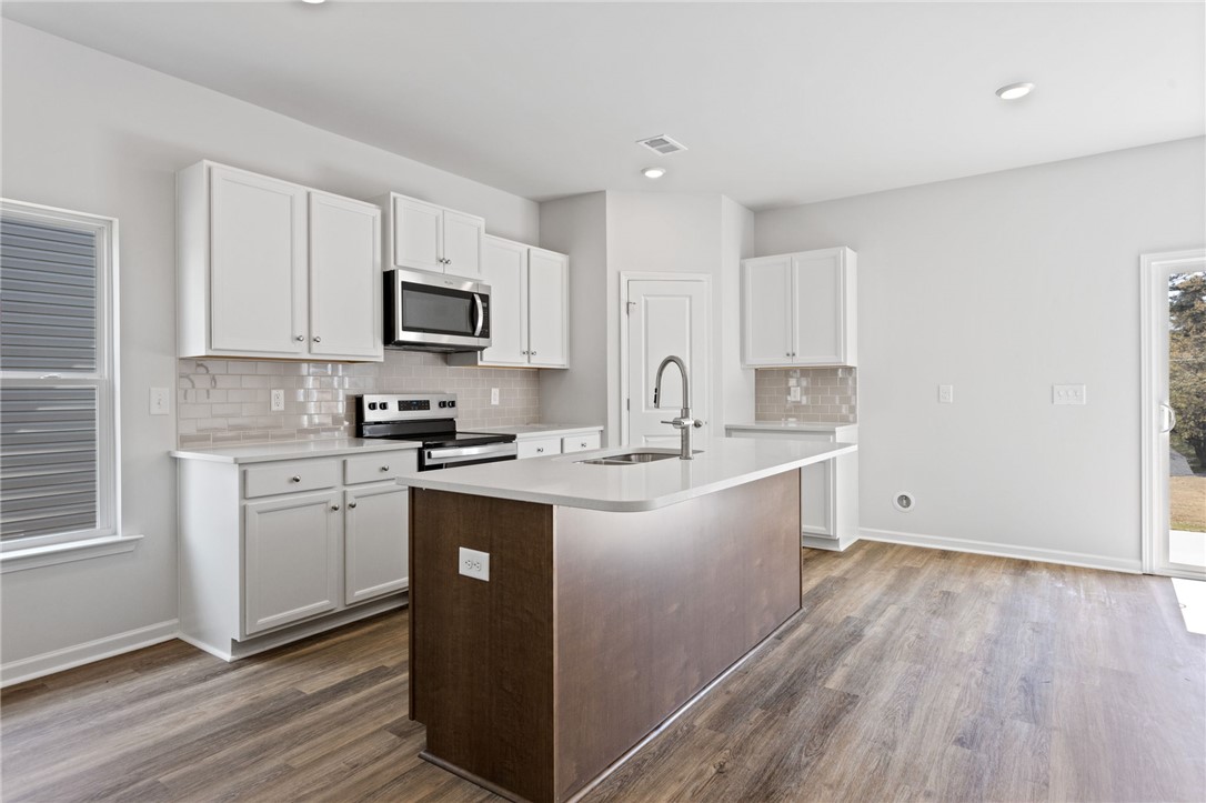 146 Cedar Shoals Easley, SC 29640 - Photo 9 of 34 This kitchen offers a practical layout and modern finishes, perfect for daily living and entertaining.