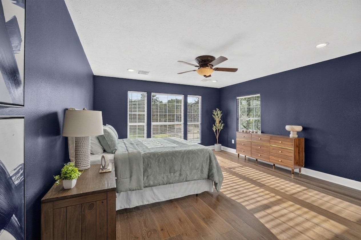 2112 Peppermill Road Houston, TX 77080 - Photo 18 of 40 With new flooring and refreshed paint, this primary suite sets a new standard for comfort, style, and move-in-ready appeal.