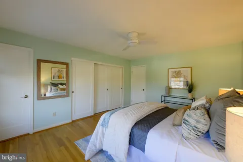 a front view of a house with a yard and fountain