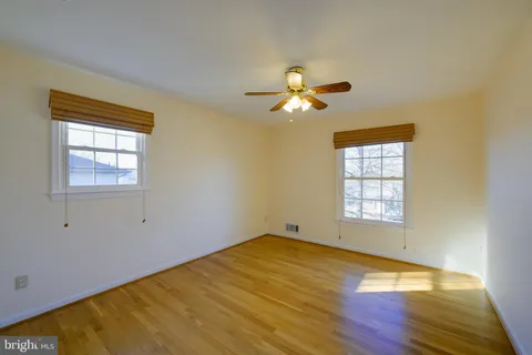 a backyard of a house with lots of green space and garden