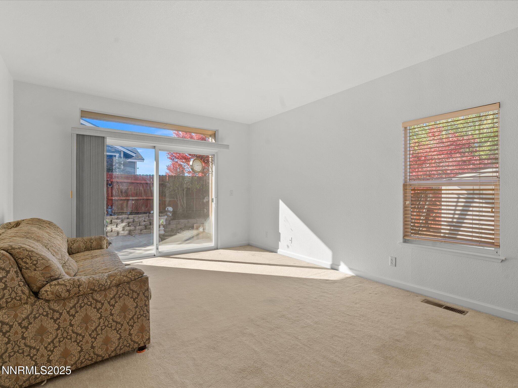 805 Sauvignon Drive Reno, NV 89506 - Photo 16 of 56 a living room with a couch and a window