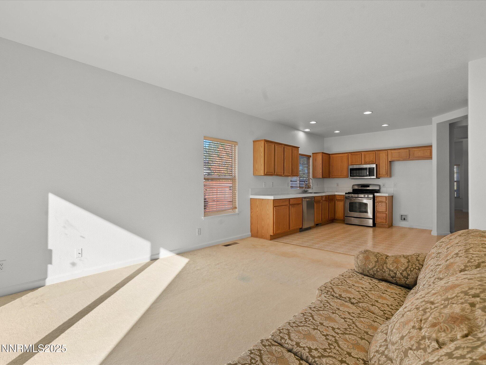 805 Sauvignon Drive Reno, NV 89506 - Photo 19 of 56 a large bedroom with a bed and window