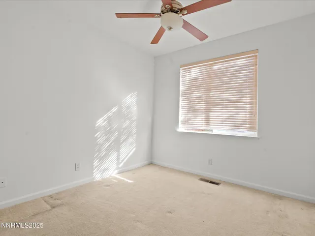 an empty room with view of hallway