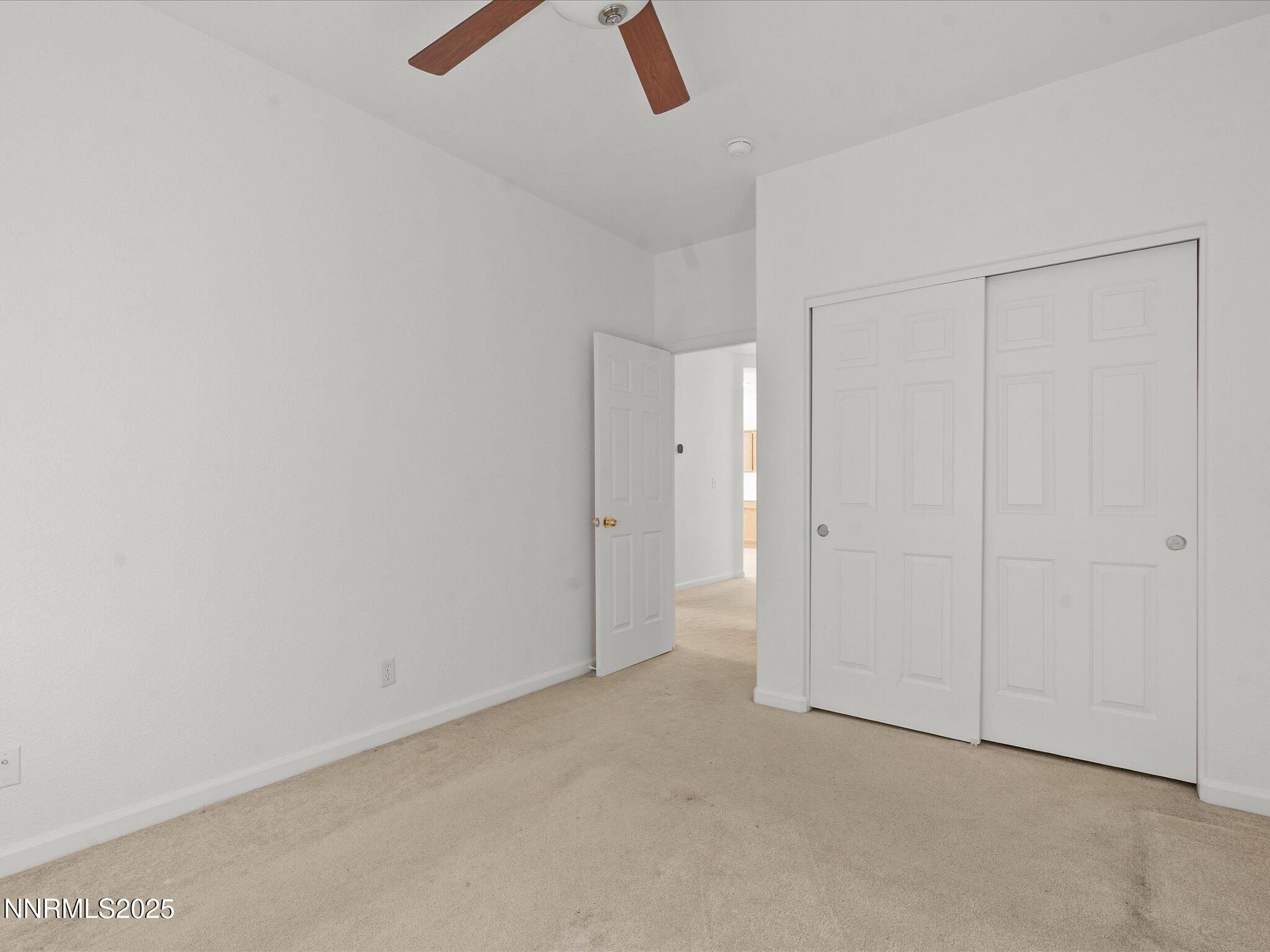 805 Sauvignon Drive Reno, NV 89506 - Photo 29 of 56 an empty room with view of hallway