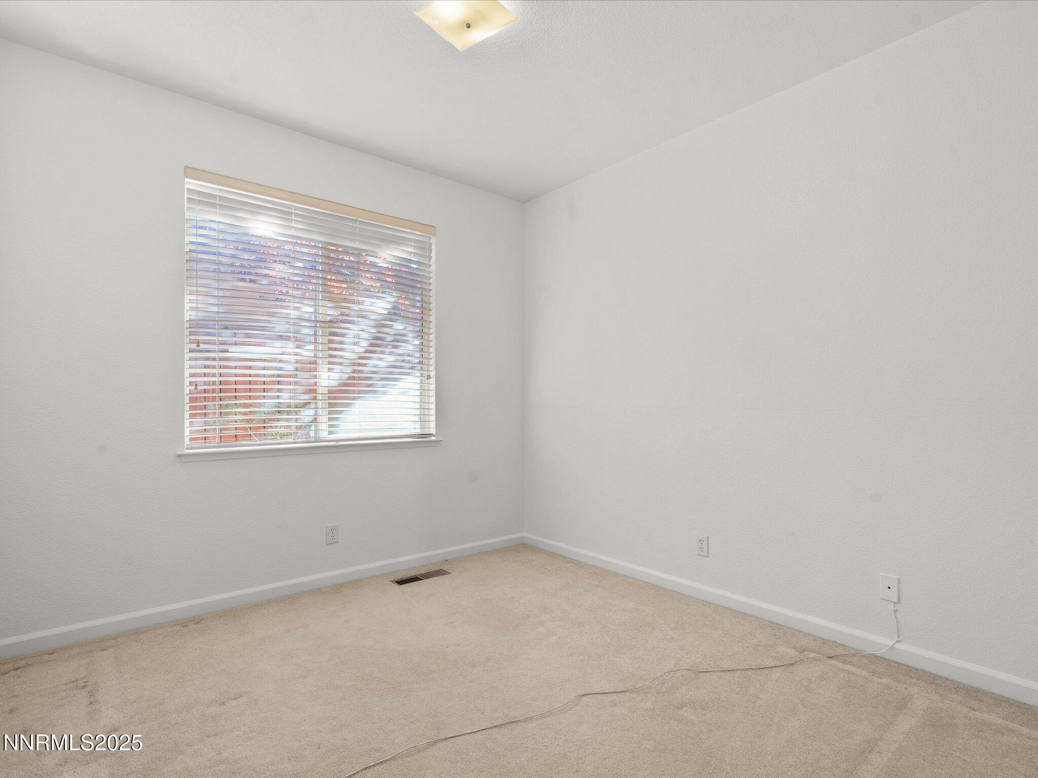 805 Sauvignon Drive Reno, NV 89506 - Photo 30 of 56 an empty room with a window