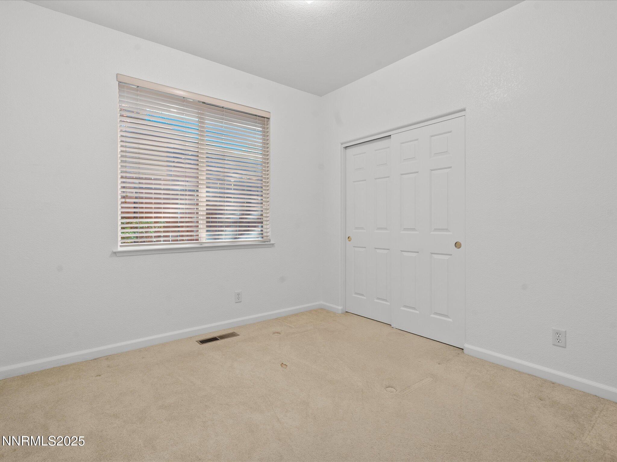 805 Sauvignon Drive Reno, NV 89506 - Photo 33 of 56 an empty room with a window