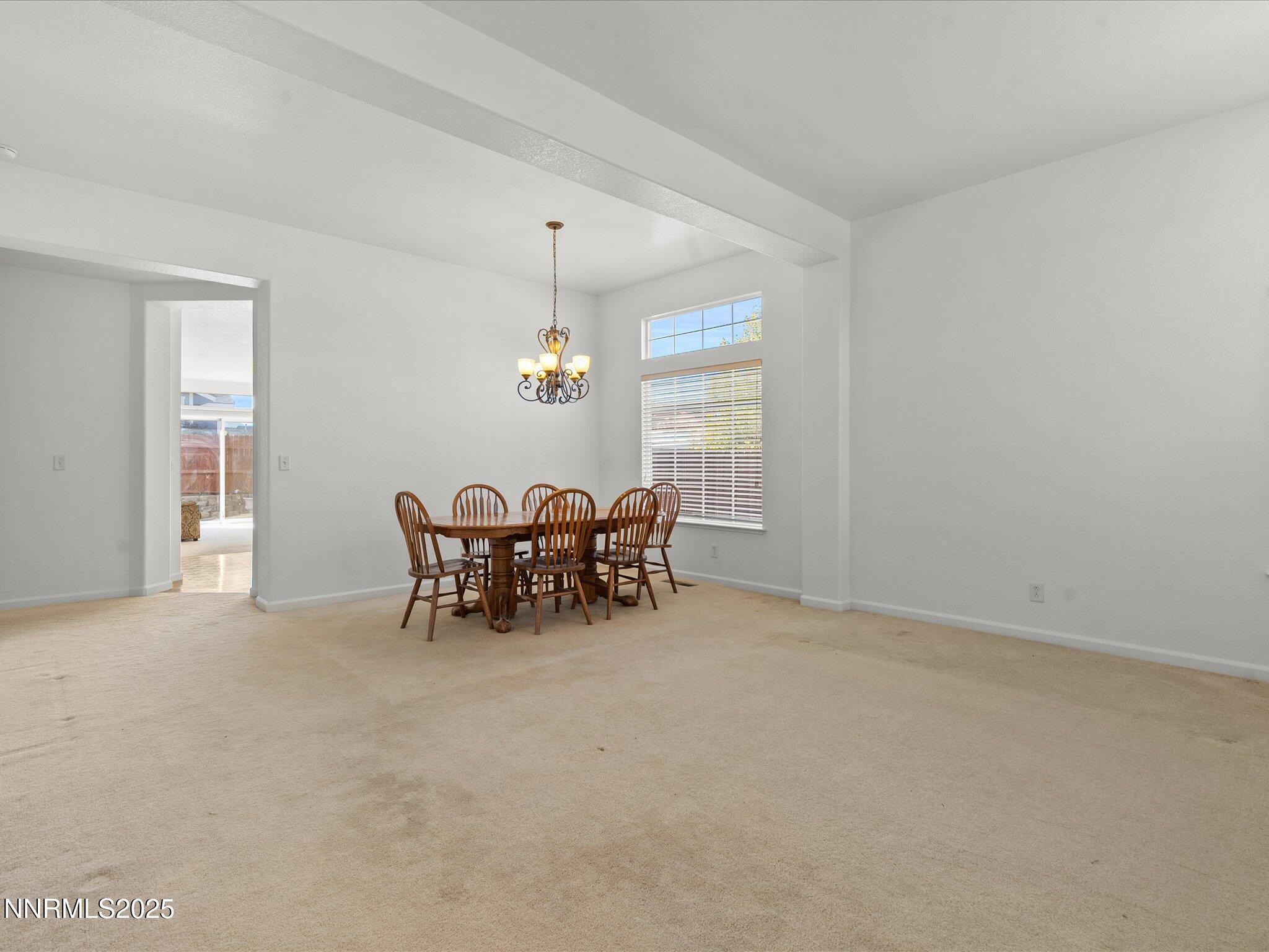 805 Sauvignon Drive Reno, NV 89506 - Photo 4 of 56 an empty room with furniture and window