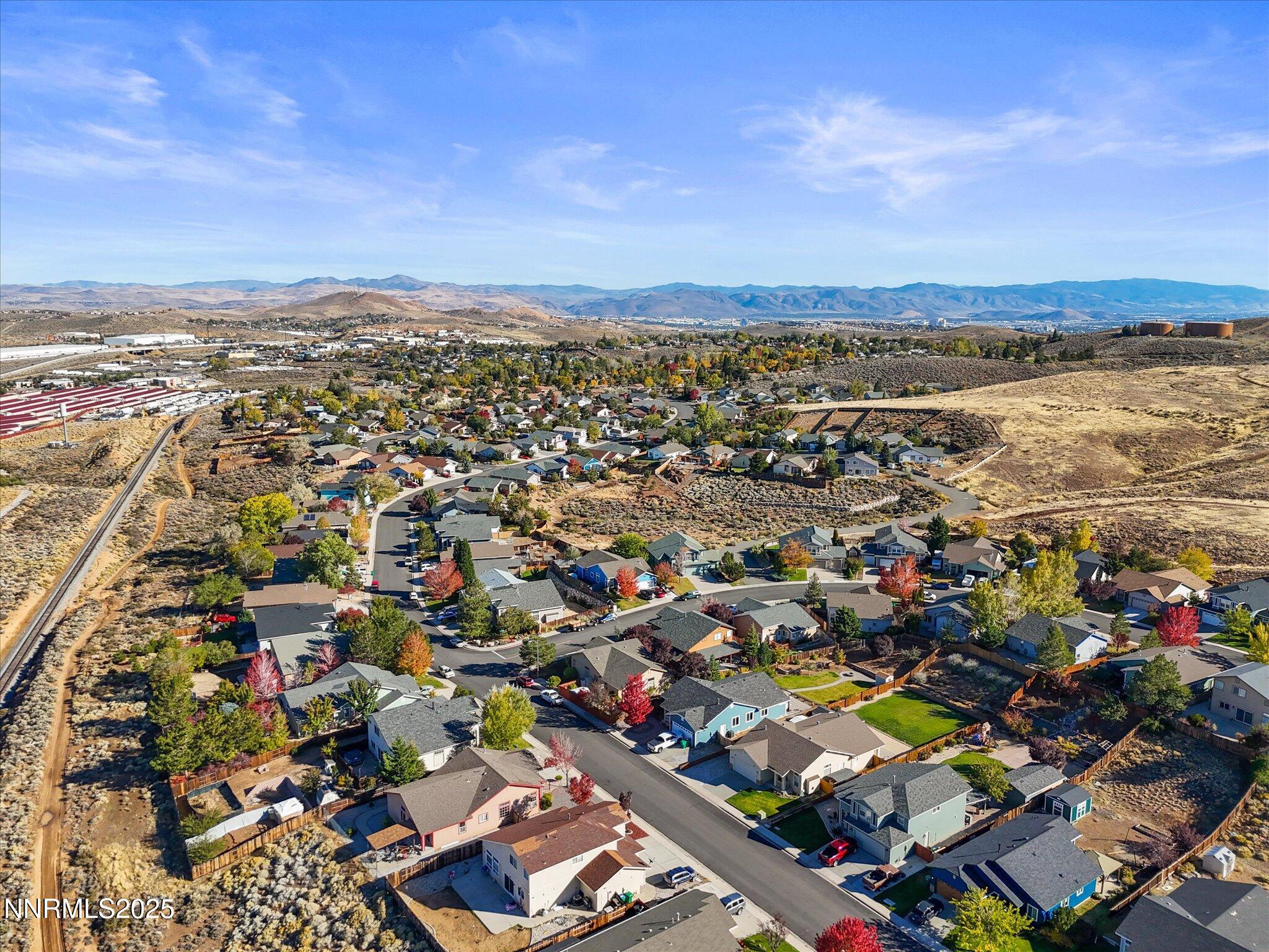 805 Sauvignon Drive Reno, NV 89506 - Photo 53 of 56 an aerial view of a city with lots of residential buildings and ocean view in back