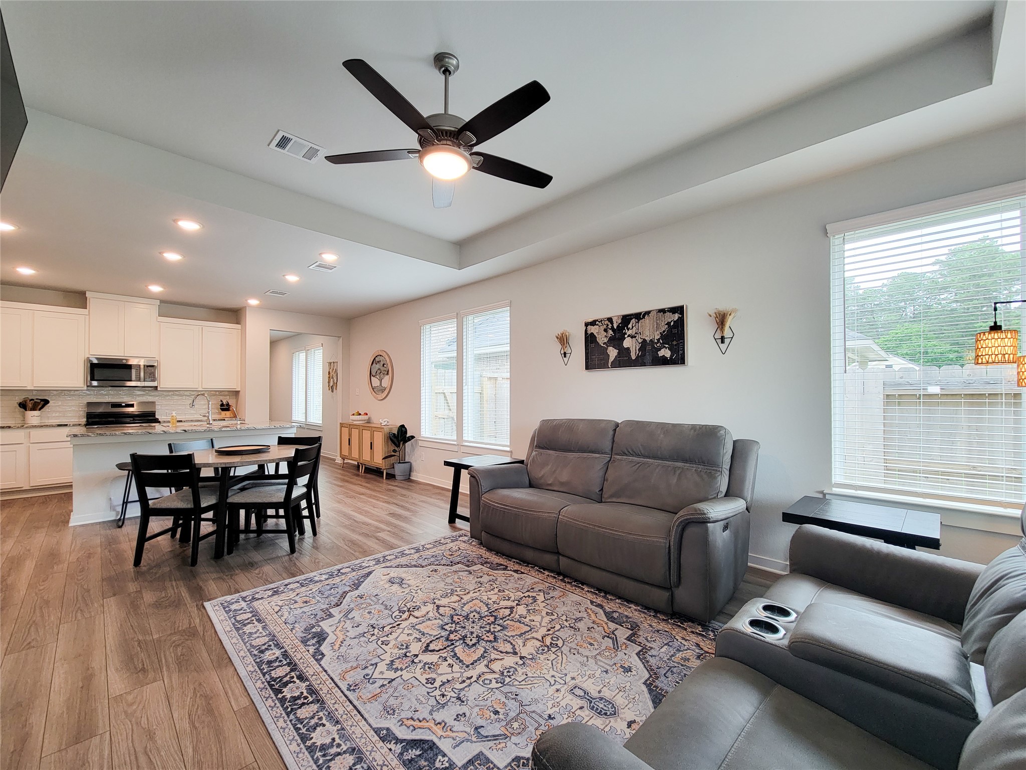 2818 Bluebonnet Ridge Drive Conroe, TX 77304 - Photo 21 of 42 a living room with furniture kitchen view and a large window
