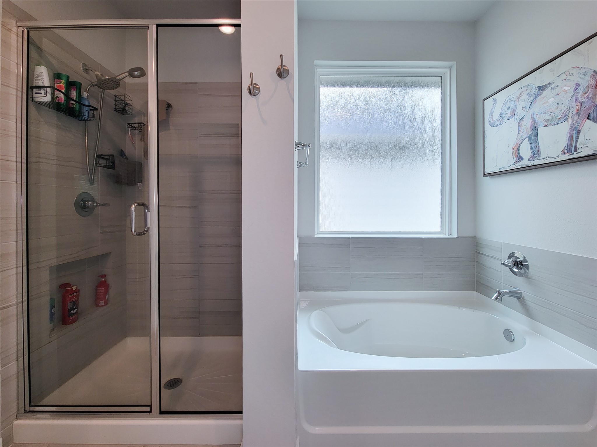 2818 Bluebonnet Ridge Drive Conroe, TX 77304 - Photo 27 of 42 a bathroom with a bathtub and a shower