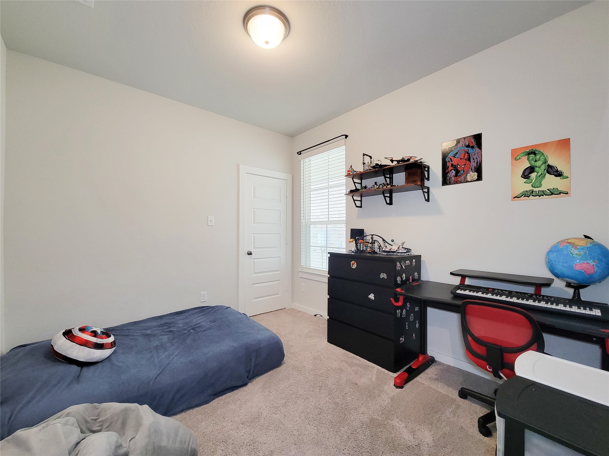 2818 Bluebonnet Ridge Drive Conroe, TX 77304 - Photo 30 of 42 a bedroom with a bed and a desk