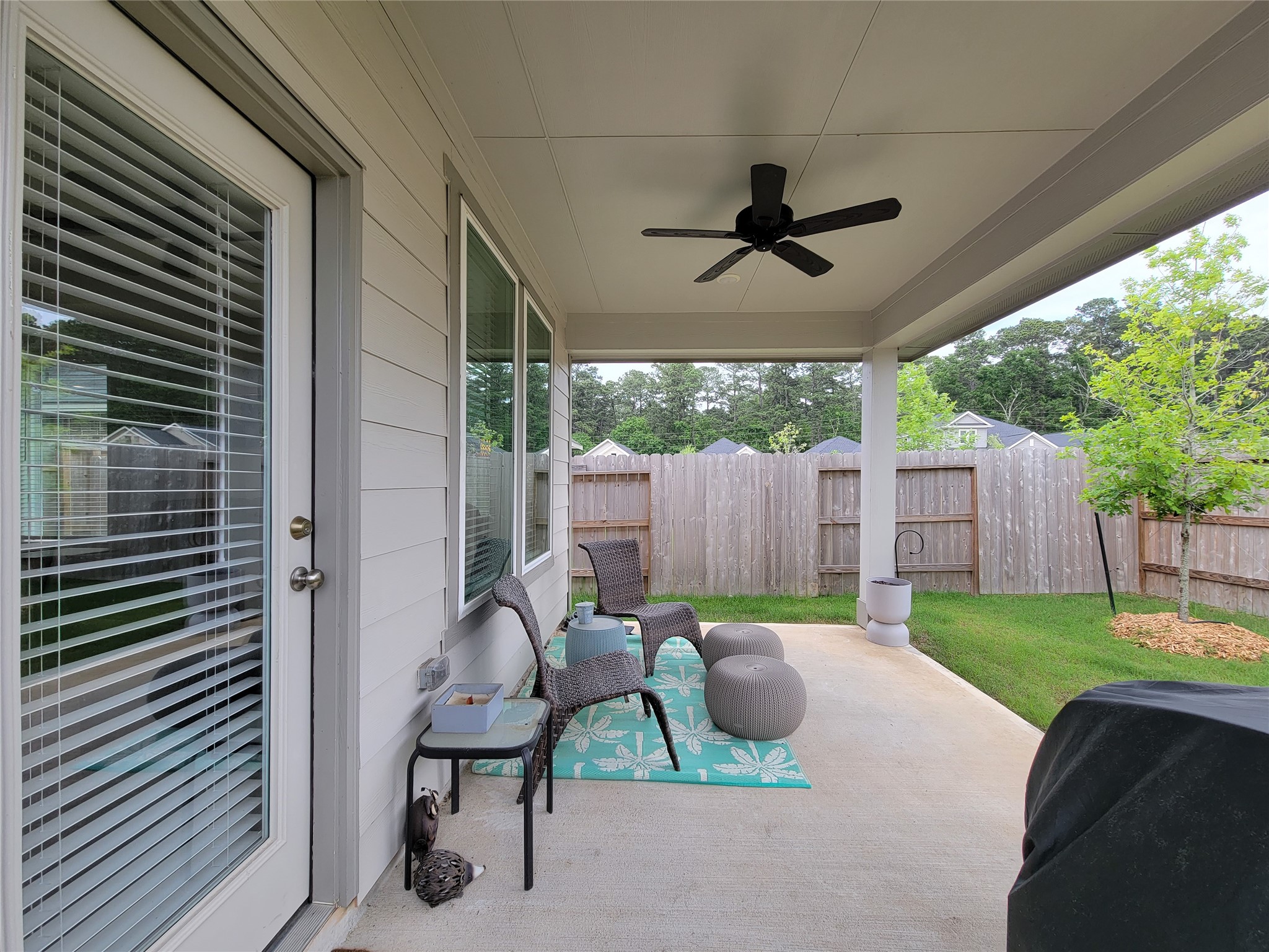 2818 Bluebonnet Ridge Drive Conroe, TX 77304 - Photo 34 of 42 a view of a patio in backyard