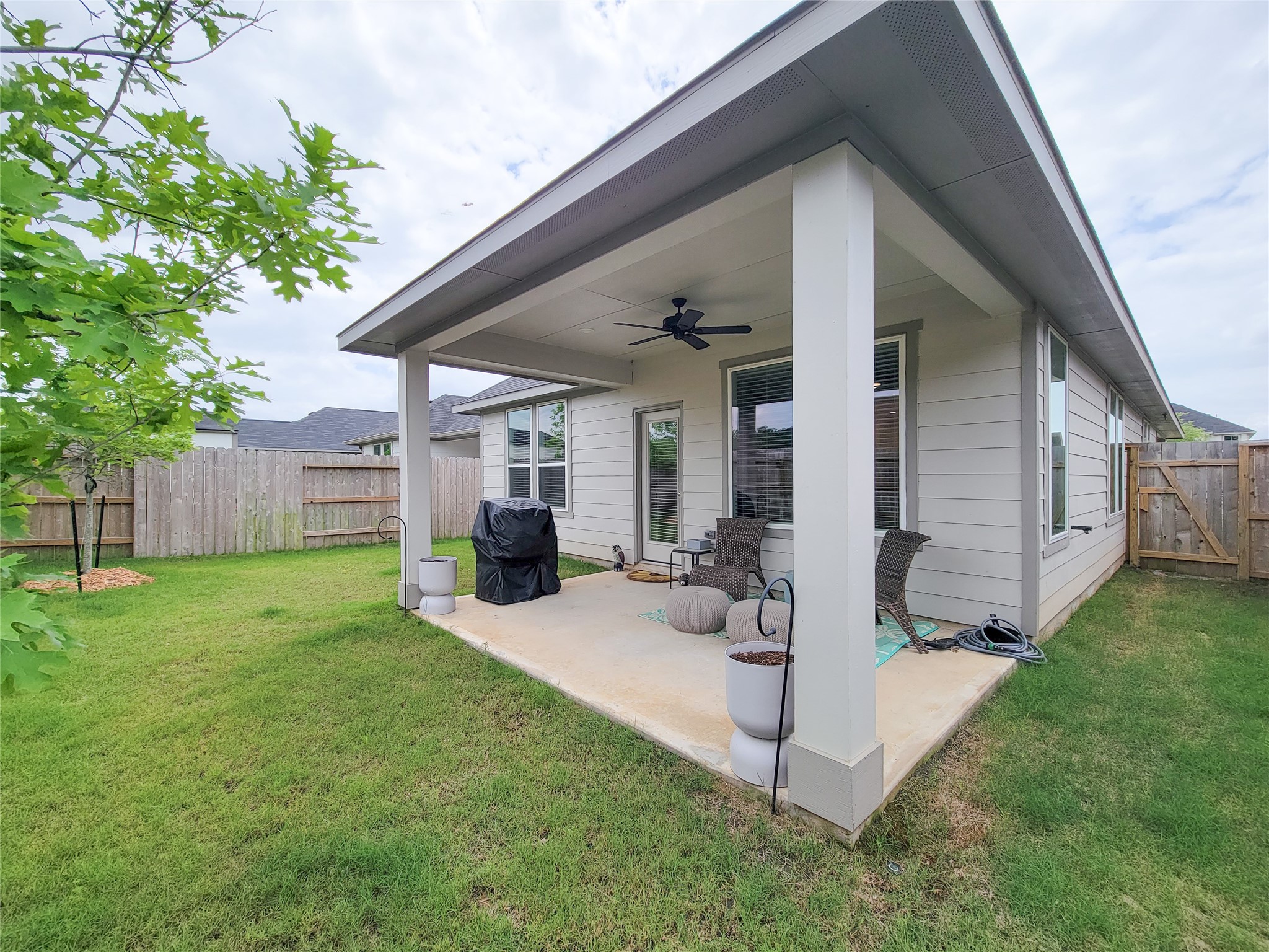 2818 Bluebonnet Ridge Drive Conroe, TX 77304 - Photo 35 of 42 a view of a house with backyard and sitting area