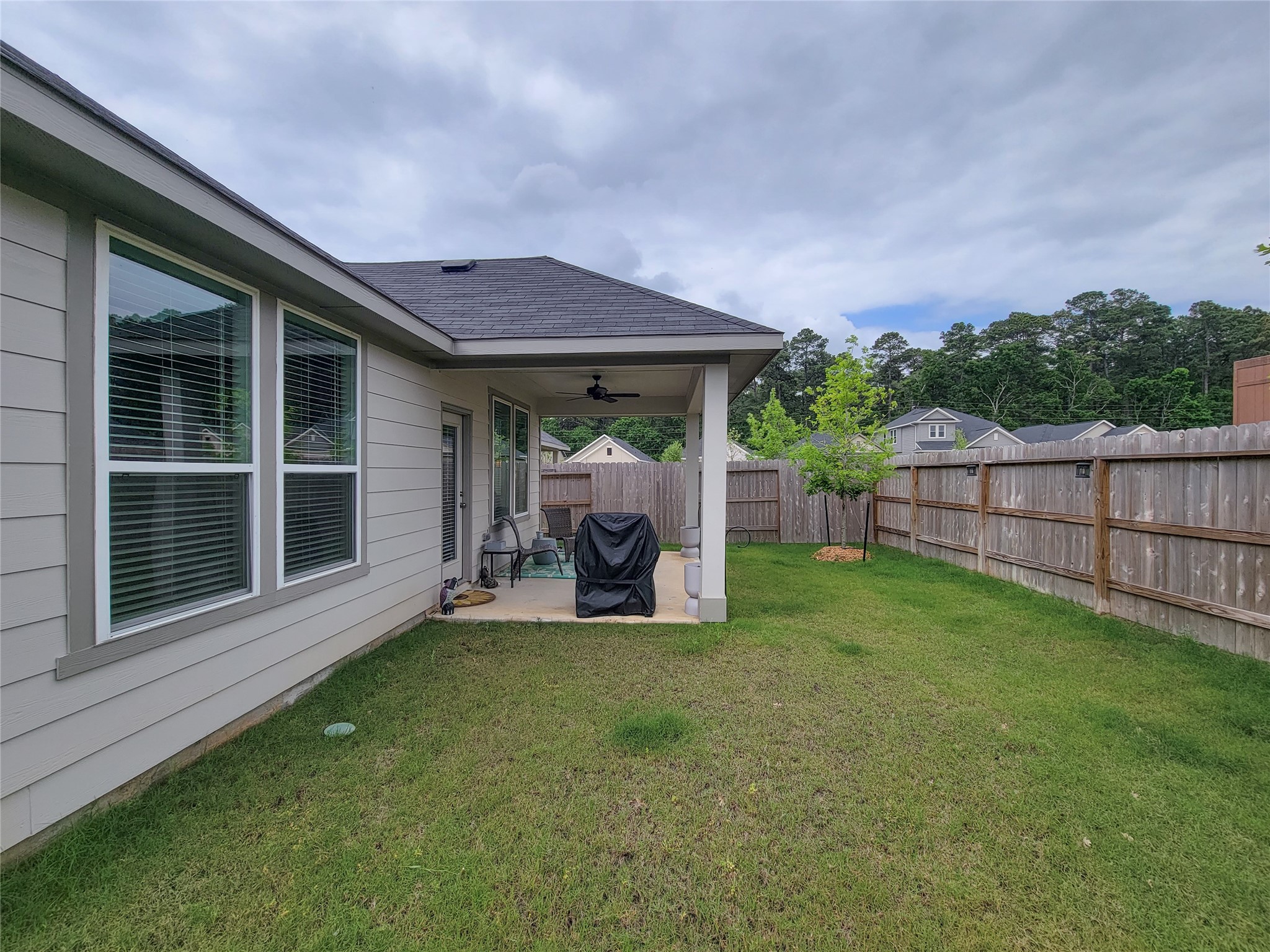 2818 Bluebonnet Ridge Drive Conroe, TX 77304 - Photo 37 of 42 a view of a house with backyard and porch