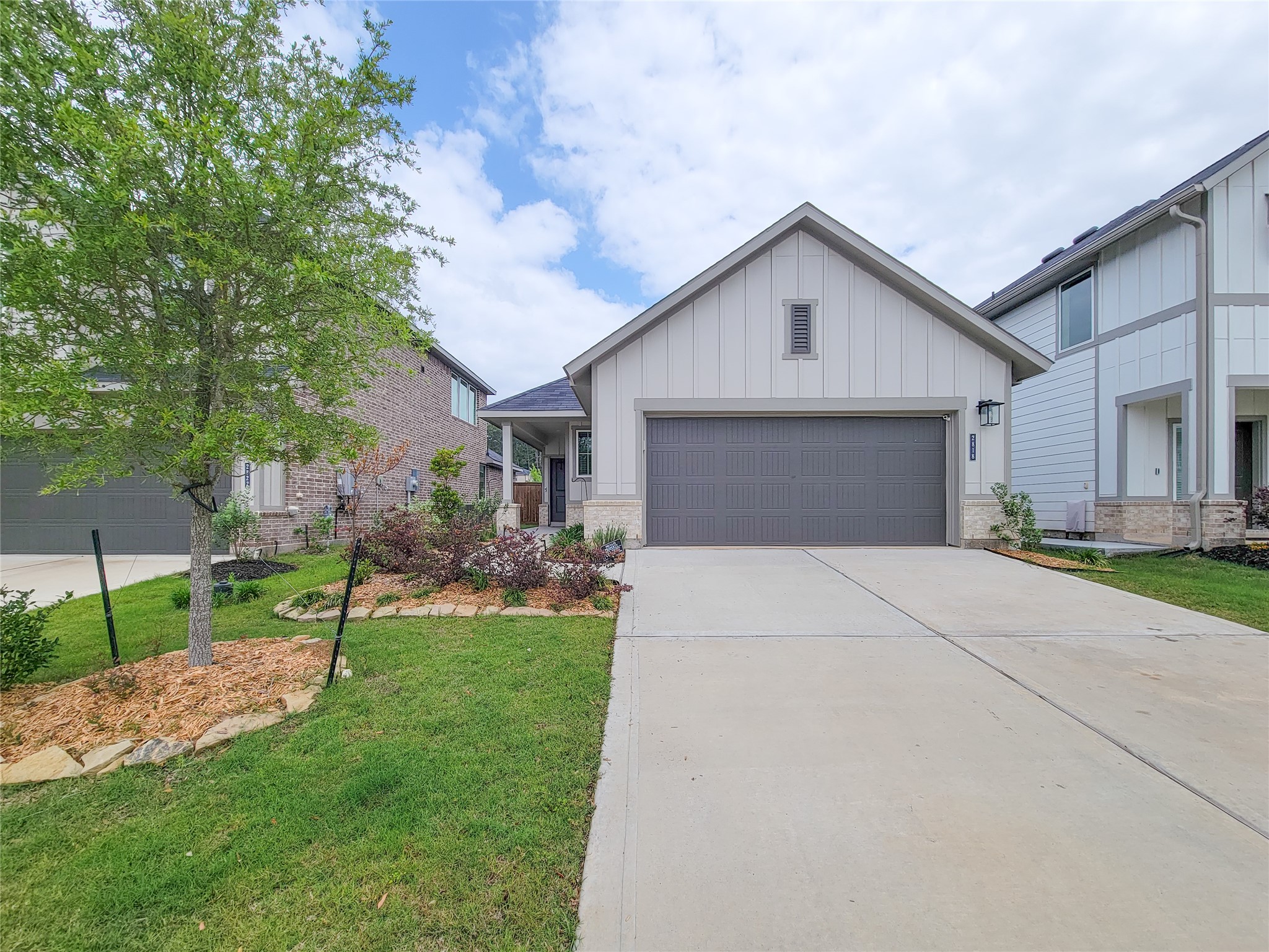 2818 Bluebonnet Ridge Drive Conroe, TX 77304 - Photo 41 of 42 a front view of house with yard and green space