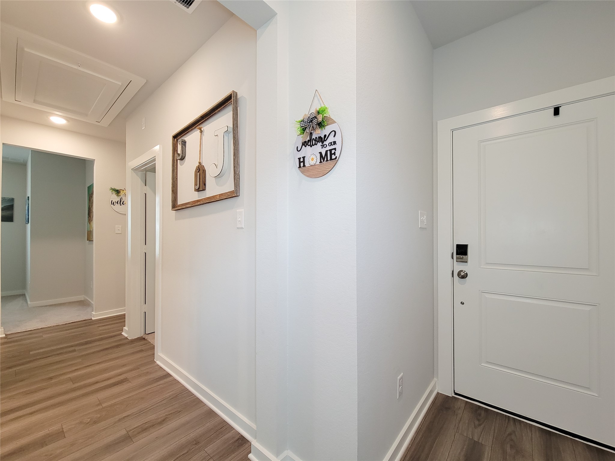 2818 Bluebonnet Ridge Drive Conroe, TX 77304 - Photo 10 of 42 a view of hallway with wooden floor