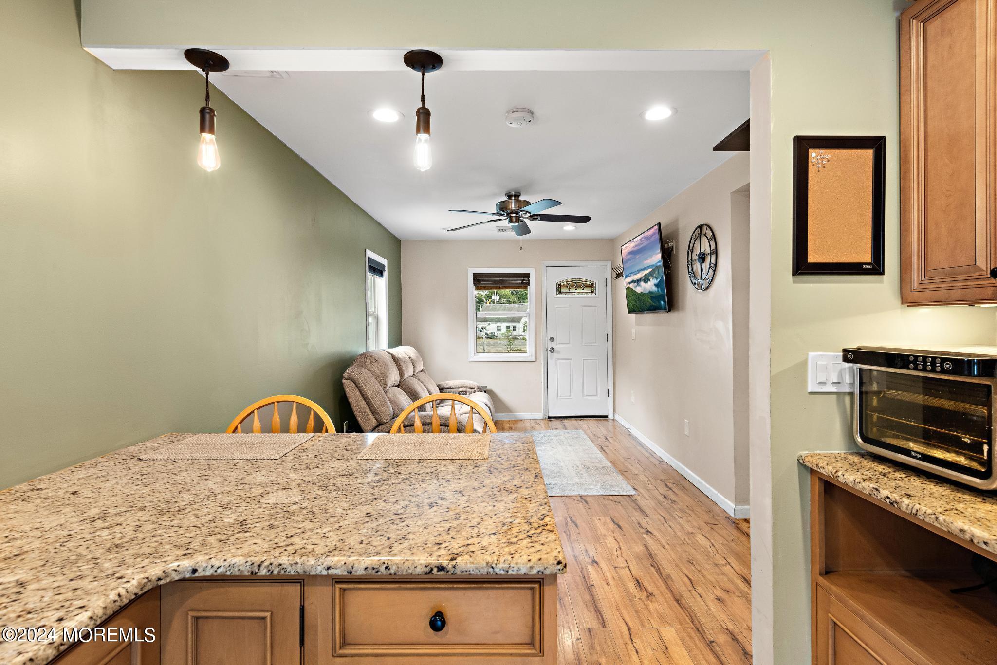 71 Highfield Avenue Matawan, NJ 07747 - Photo 11 of 24 a kitchen with stainless steel appliances granite countertop a sink a stove and a refrigerator