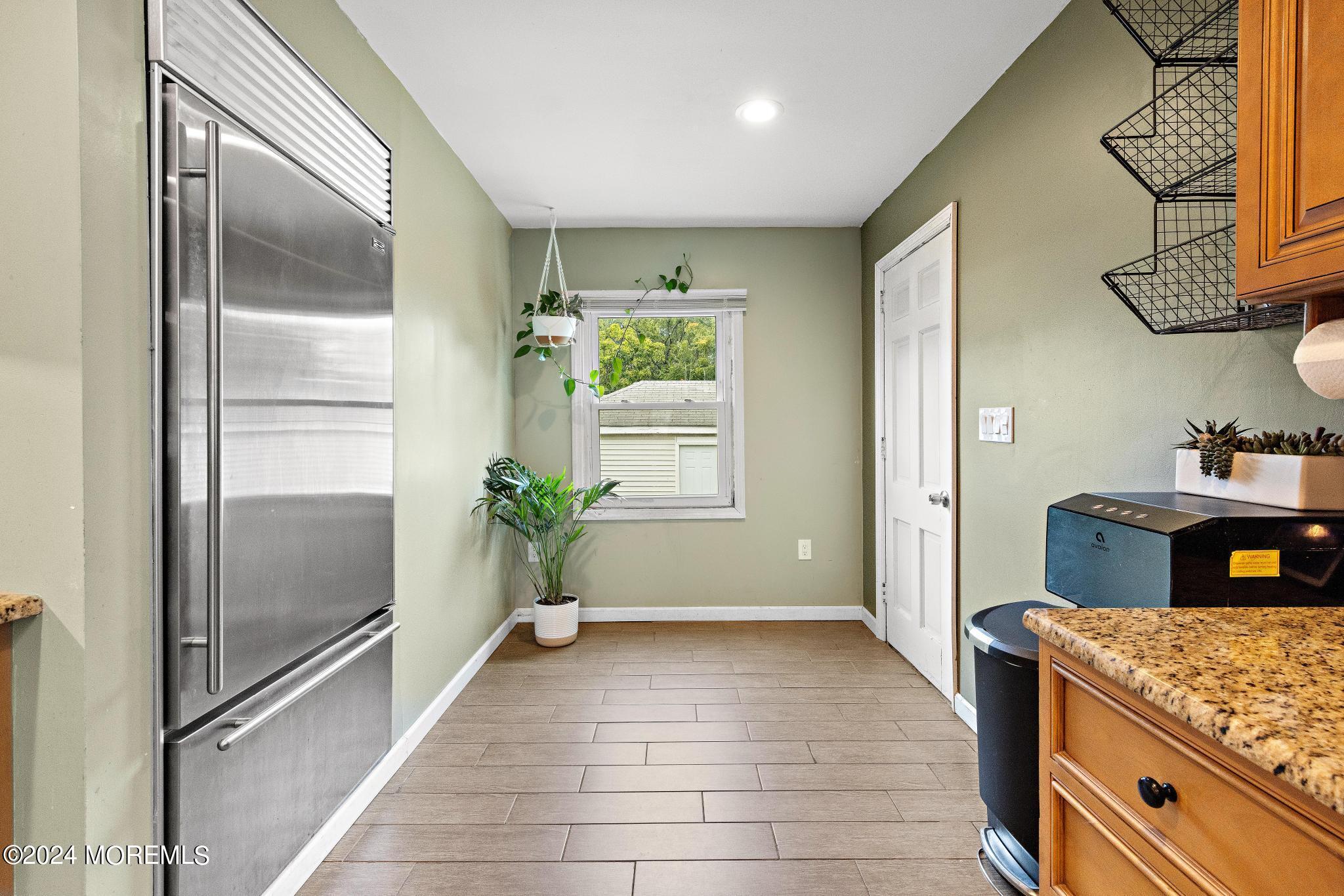 71 Highfield Avenue Matawan, NJ 07747 - Photo 12 of 24 a bathroom with a granite countertop sink a mirror and shower
