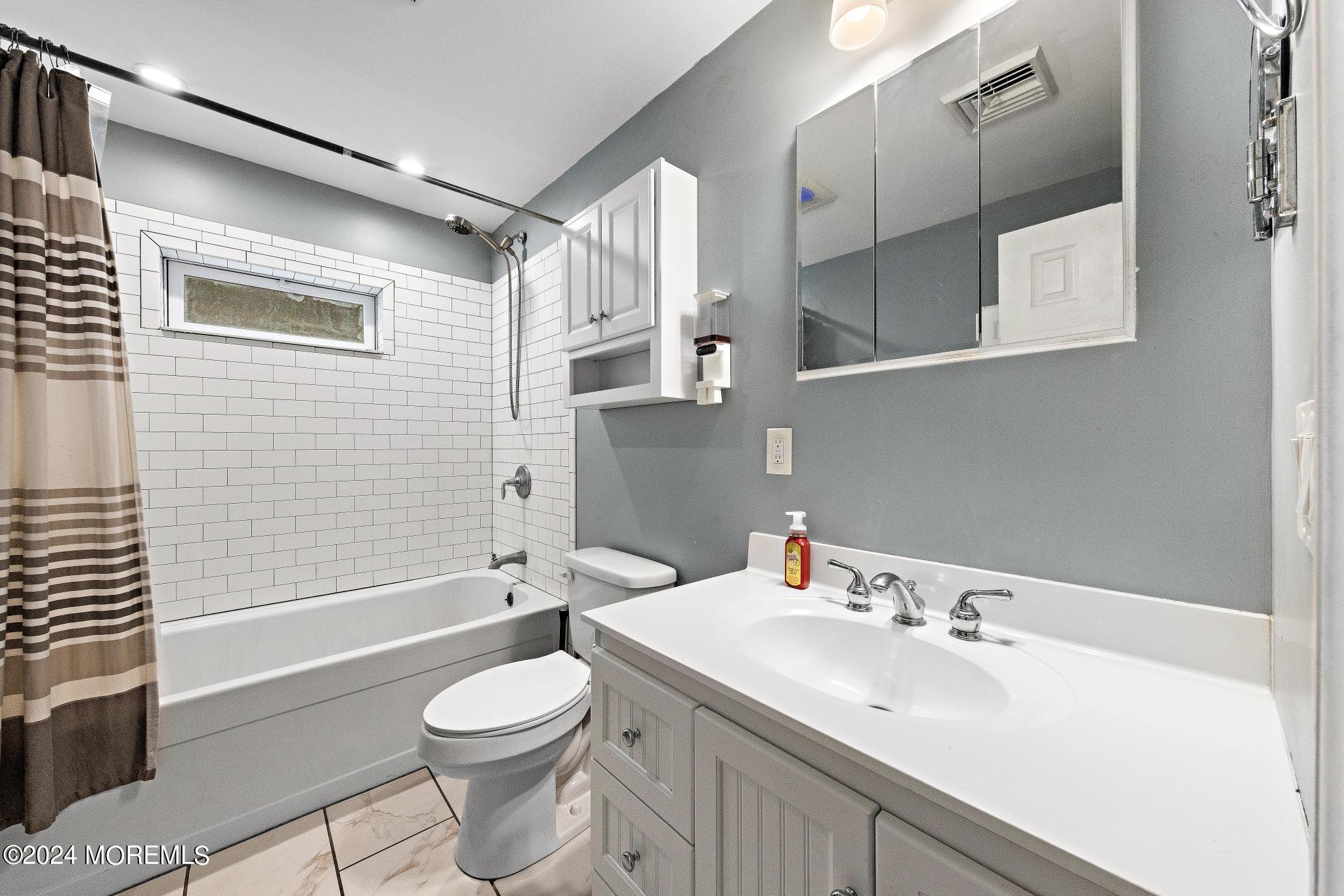 71 Highfield Avenue Matawan, NJ 07747 - Photo 14 of 24 a bathroom with a sink toilet and shower