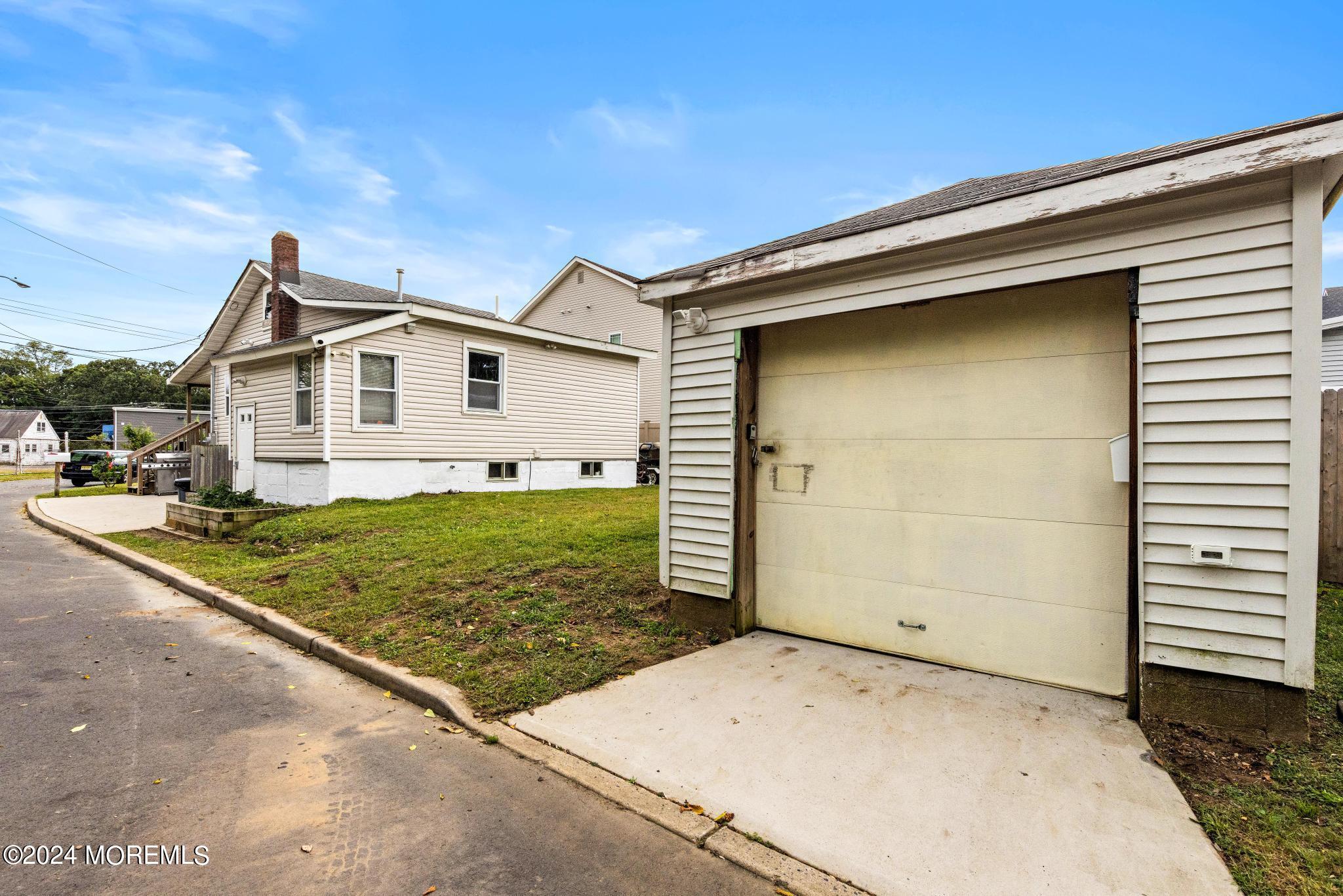 71 Highfield Avenue Matawan, NJ 07747 - Photo 20 of 24 a view of a house with a yard