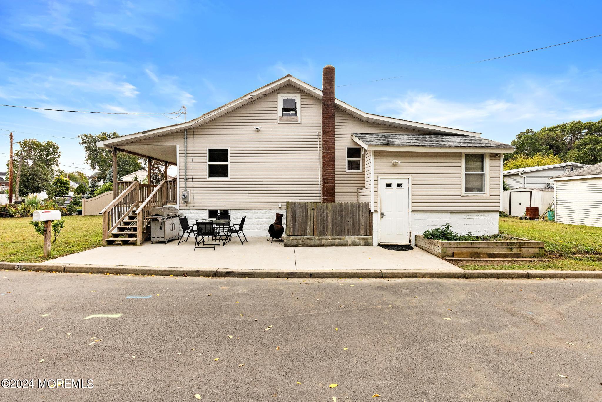 71 Highfield Avenue Matawan, NJ 07747 - Photo 22 of 24 a view of a house with a patio