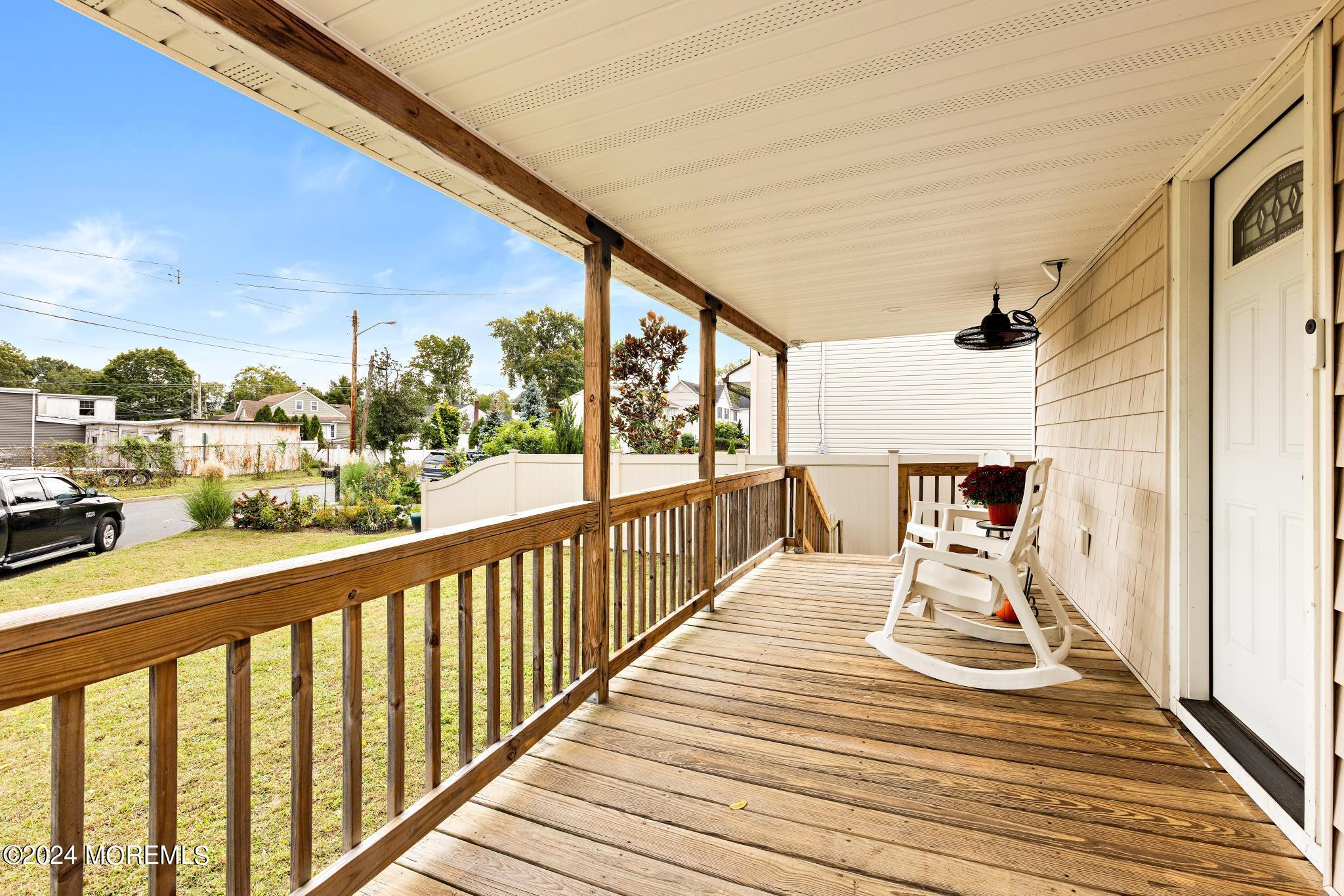 71 Highfield Avenue Matawan, NJ 07747 - Photo 5 of 24 a view of a balcony with wooden floor
