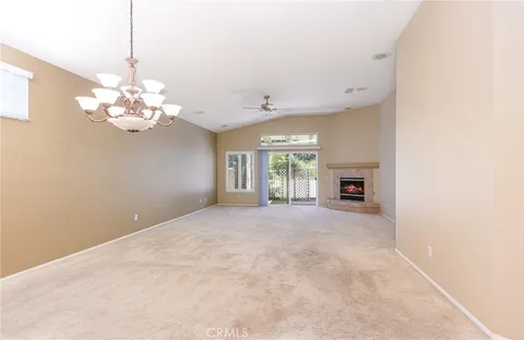 an empty room with a empty space and windows