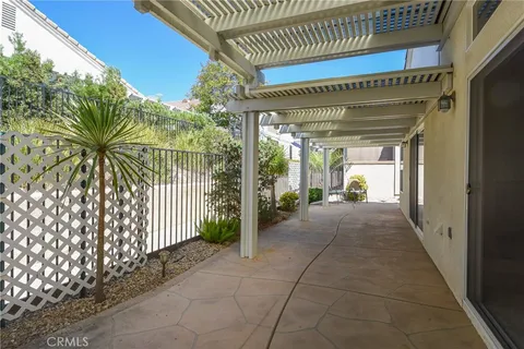 a view of a hallway with potted plants