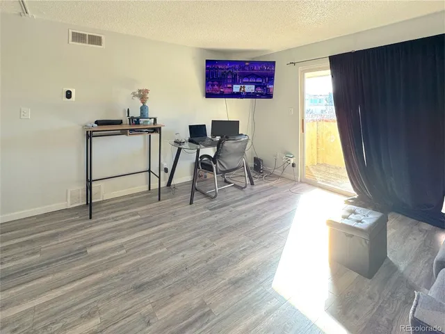 a workspace with furniture and window