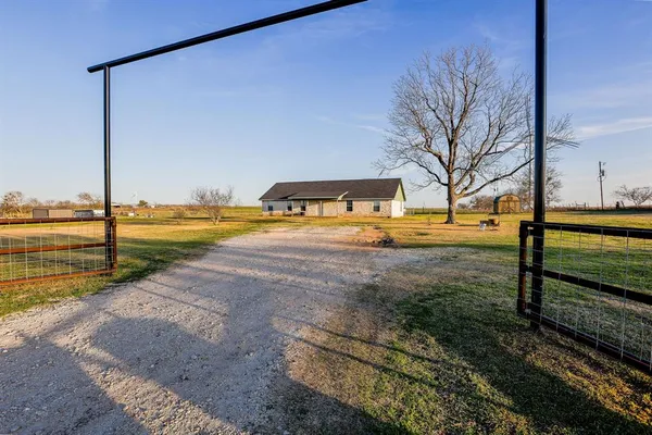 a view of a yard with an outdoor space