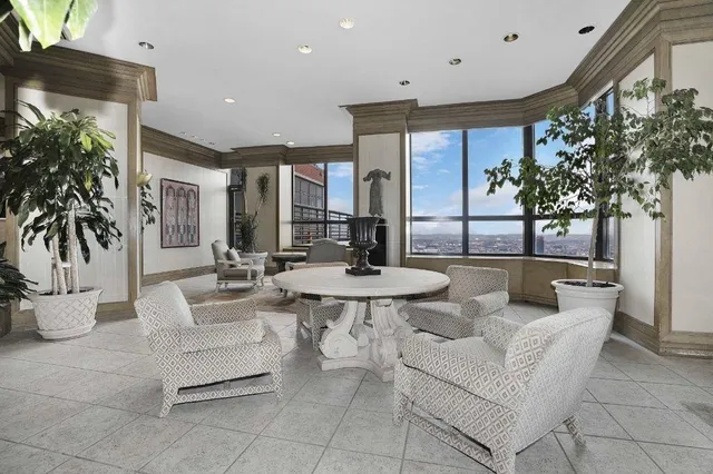 a large kitchen with a table and chairs