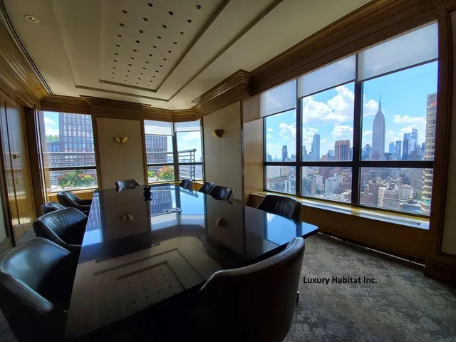 a room with pool table table and chairs