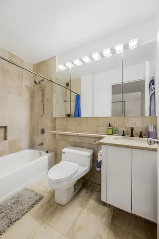 a bedroom with a bed and a table