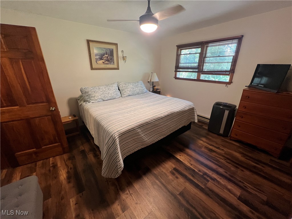 86422 North Bay Road Scio, OH 43988 - Photo 11 of 47 Bedroom with dark wood-type flooring, baseboard heating, and ceiling fan