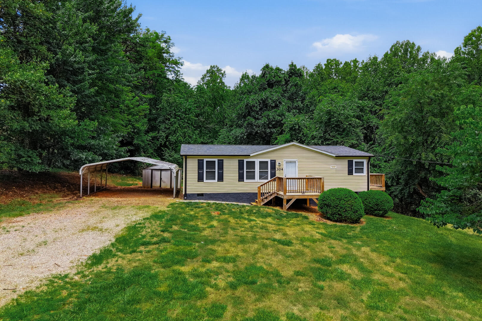 304 Ridgelake Road Goodview, VA 24095 - Photo 25 of 34 a front view of a house with garden