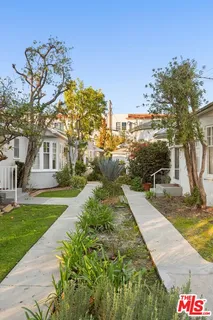 a view of a white house with a large windows