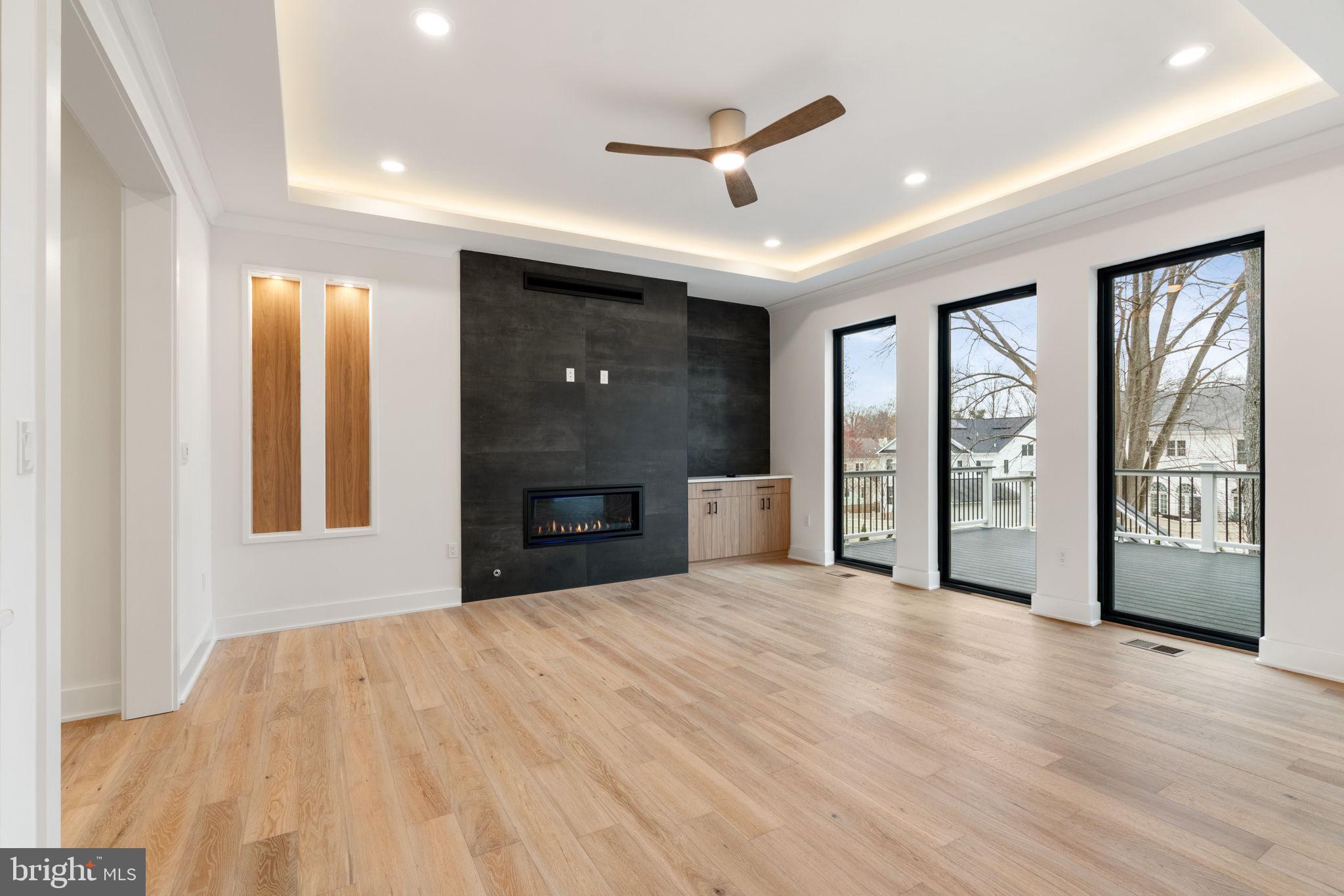 505 Adelman Circle Southwest Vienna, VA 22180 - Photo 18 of 85 a view of an empty room with a fireplace and a window