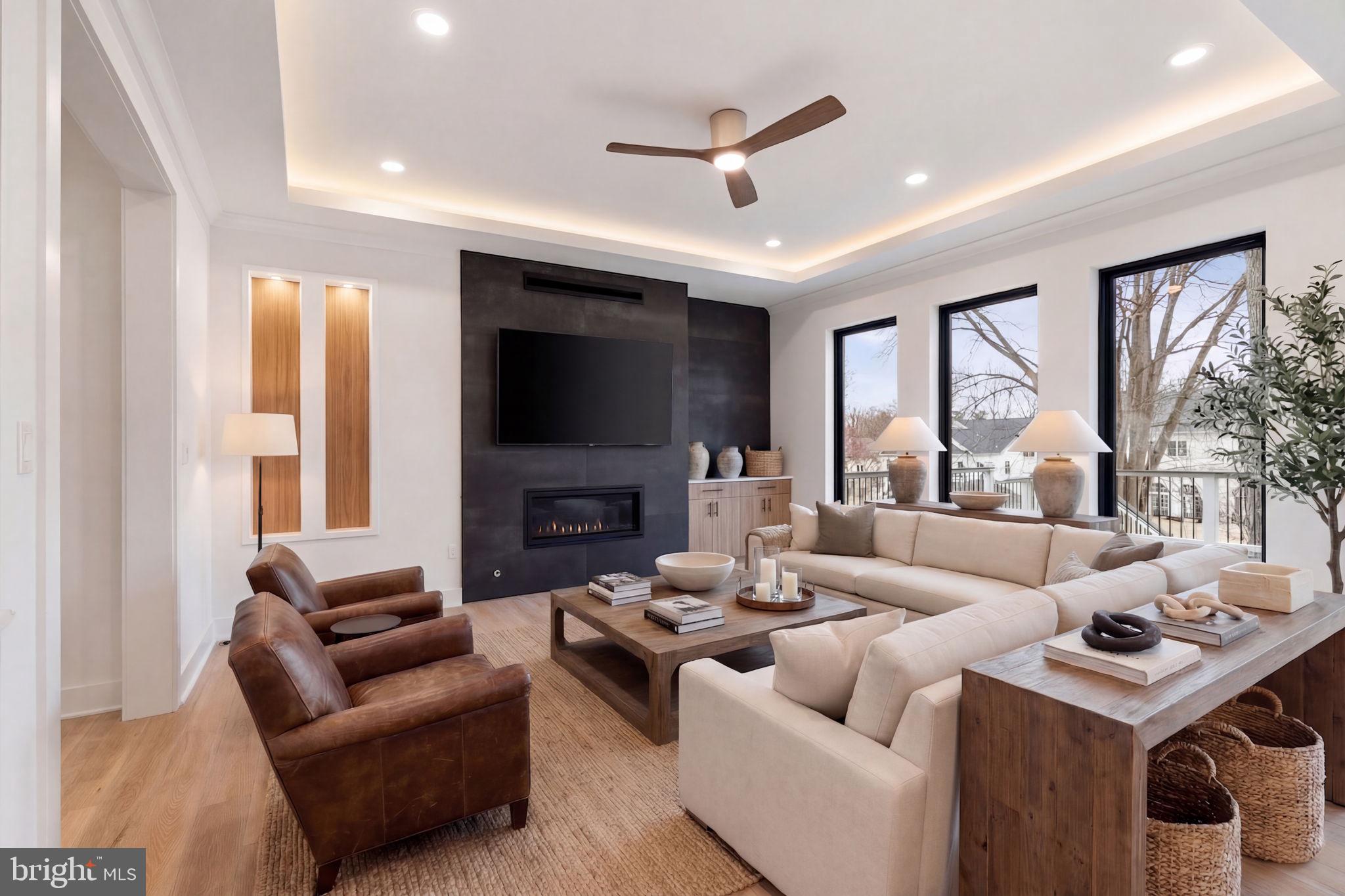 505 Adelman Circle Southwest Vienna, VA 22180 - Photo 19 of 85 a living room with fireplace furniture and a flat screen tv