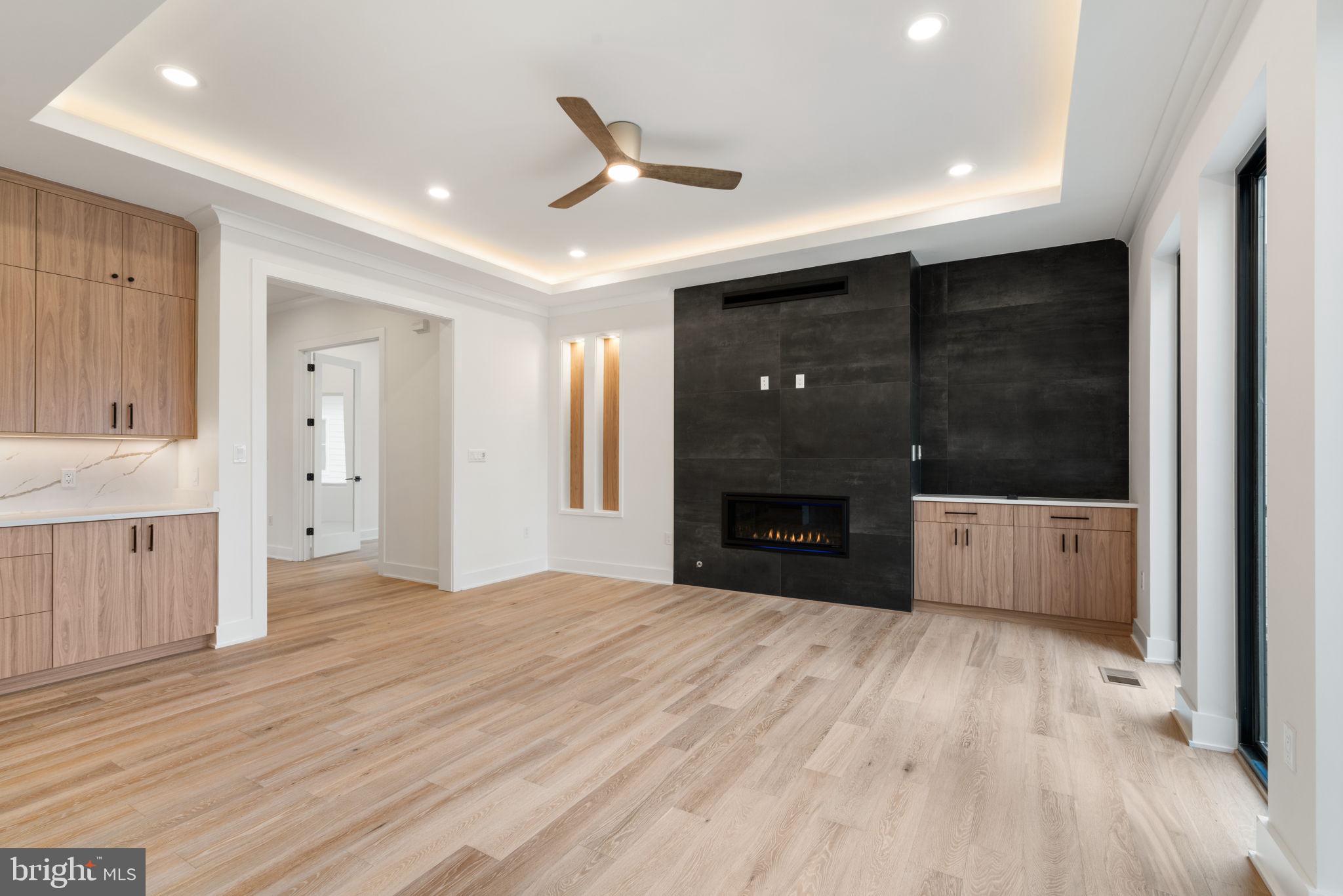 505 Adelman Circle Southwest Vienna, VA 22180 - Photo 21 of 85 a view of empty room with a fireplace and wooden floor