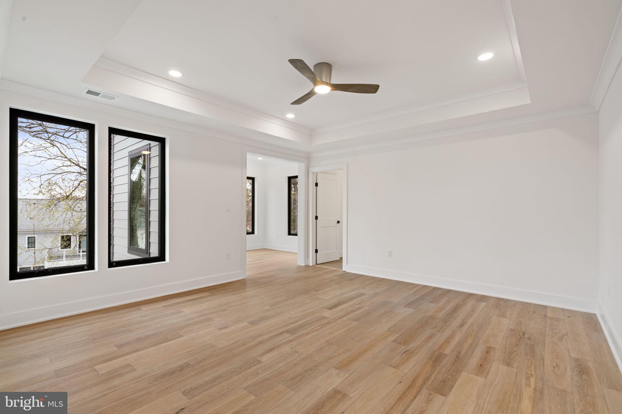 505 Adelman Circle Southwest Vienna, VA 22180 - Photo 32 of 85 a view of an empty room with wooden floor and a window