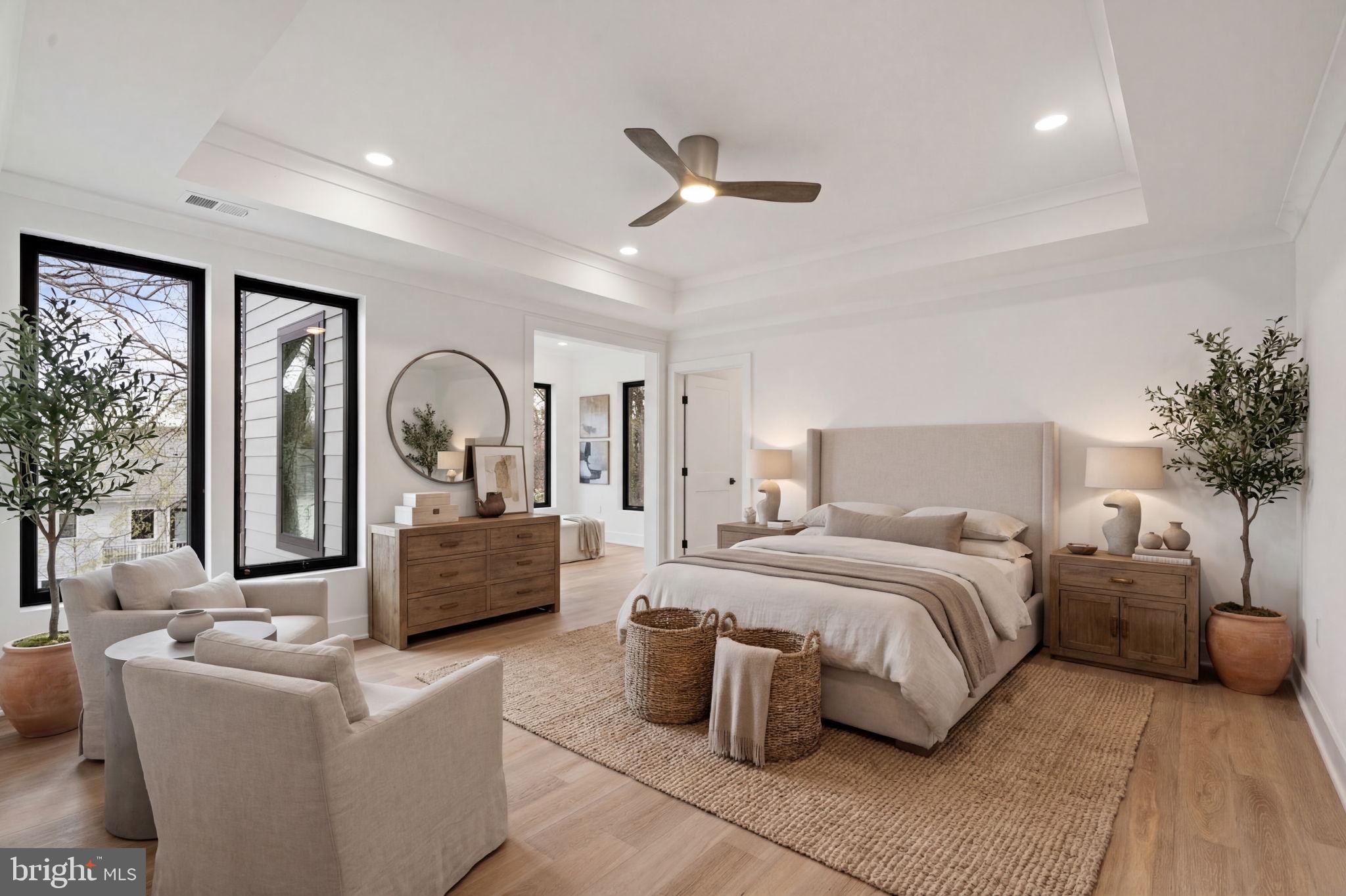 505 Adelman Circle Southwest Vienna, VA 22180 - Photo 33 of 85 a bedroom with a large bed couch and windows