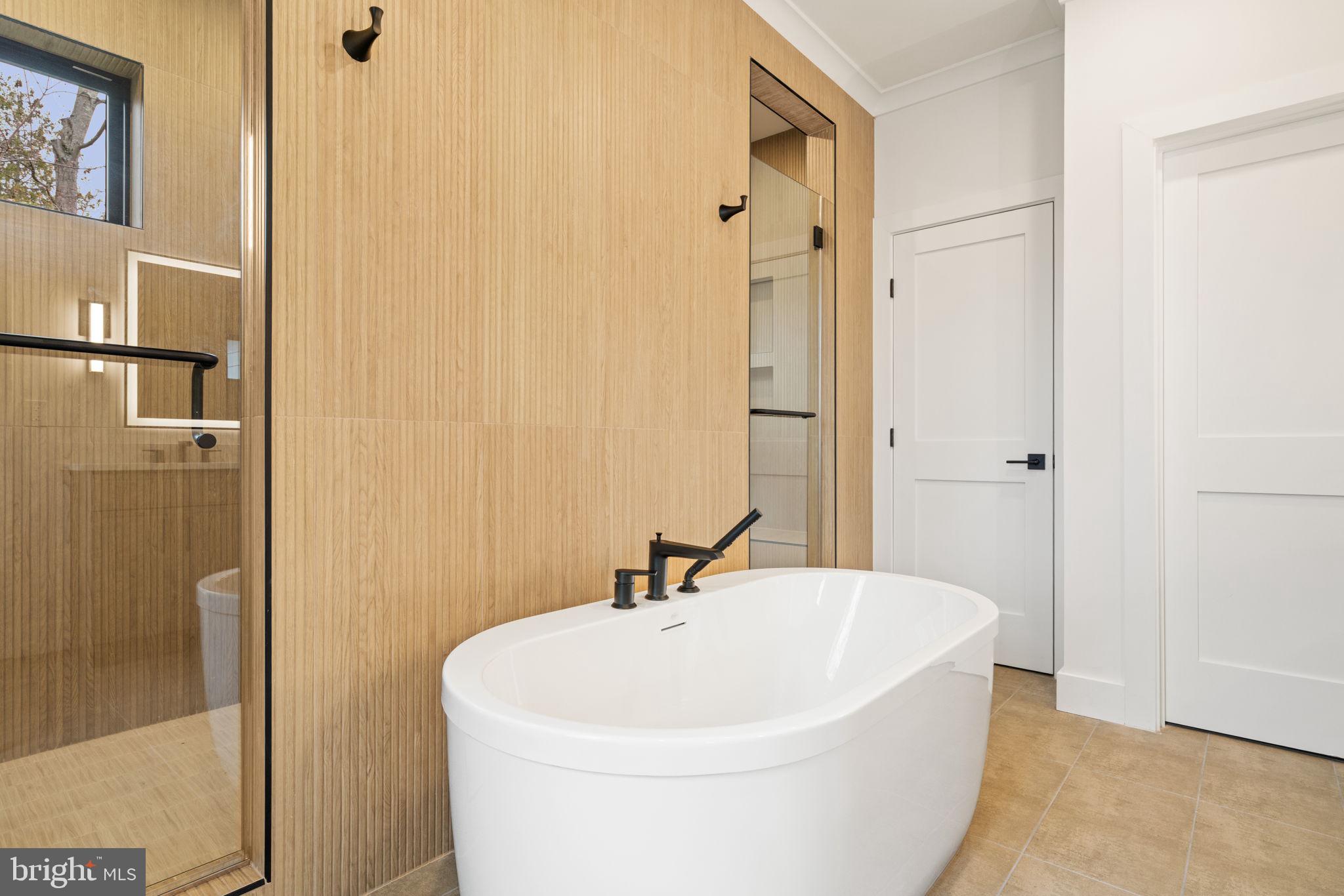 505 Adelman Circle Southwest Vienna, VA 22180 - Photo 38 of 85 a white bath tub sitting next to a white sink