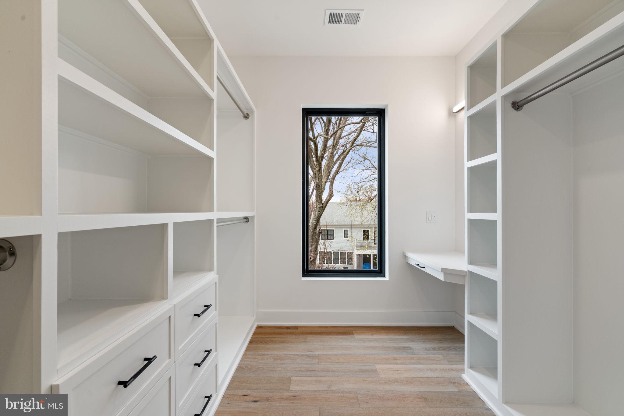 505 Adelman Circle Southwest Vienna, VA 22180 - Photo 42 of 85 a view of an empty room with wooden floor and a window