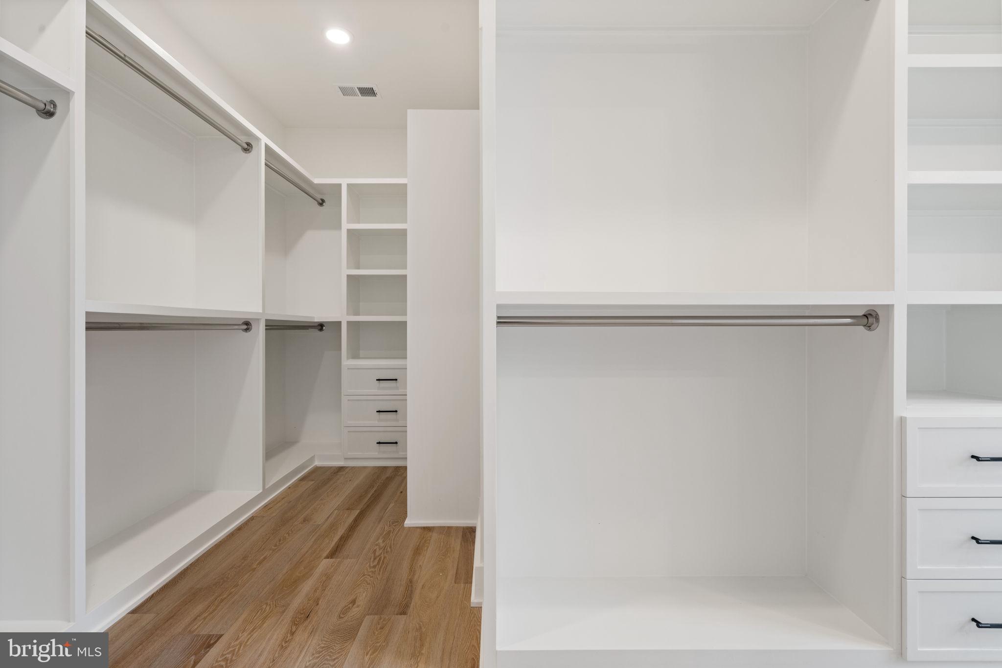 505 Adelman Circle Southwest Vienna, VA 22180 - Photo 43 of 85 a view of walk in closet with empty racks