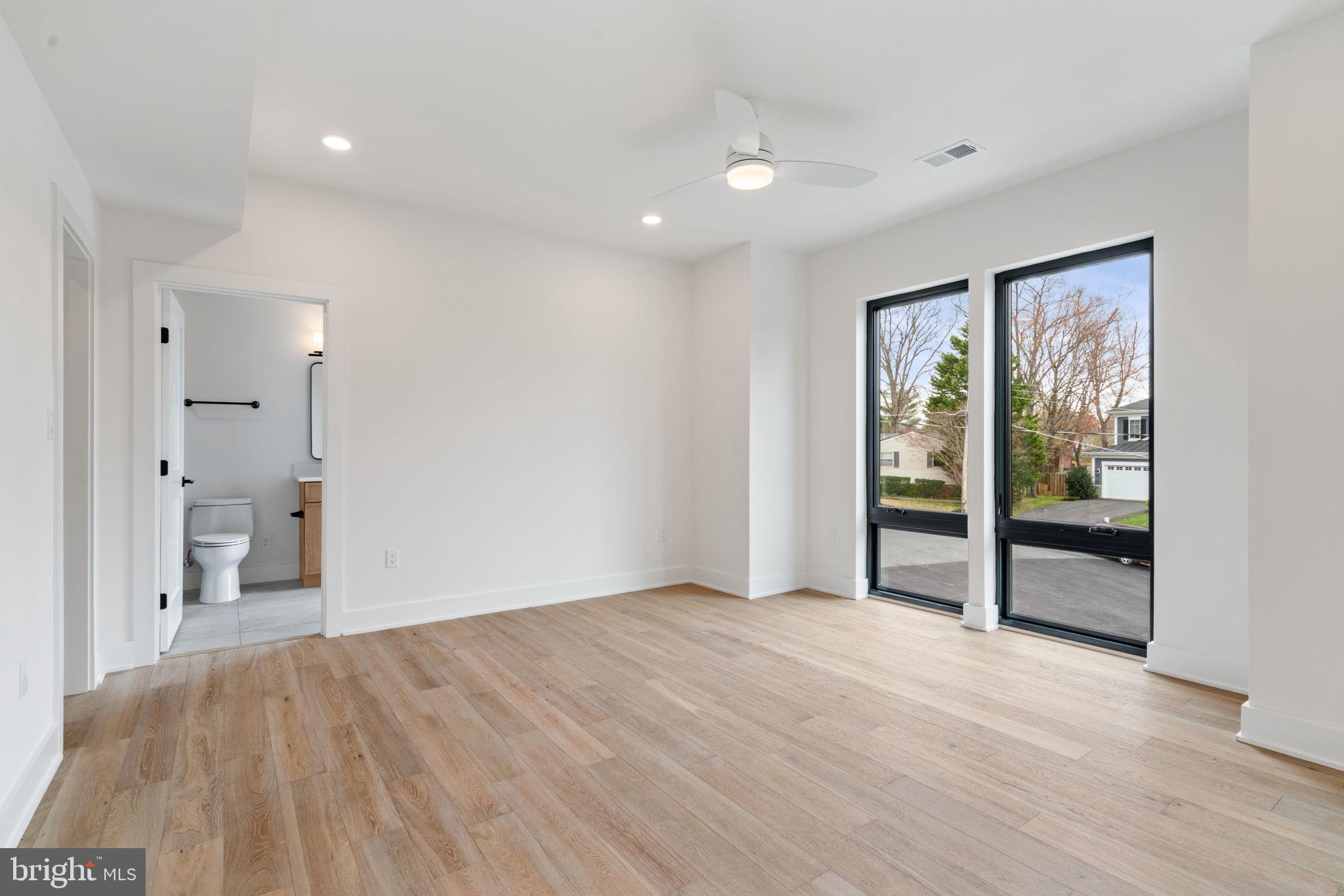 505 Adelman Circle Southwest Vienna, VA 22180 - Photo 52 of 85 wooden floor in an empty room with a window
