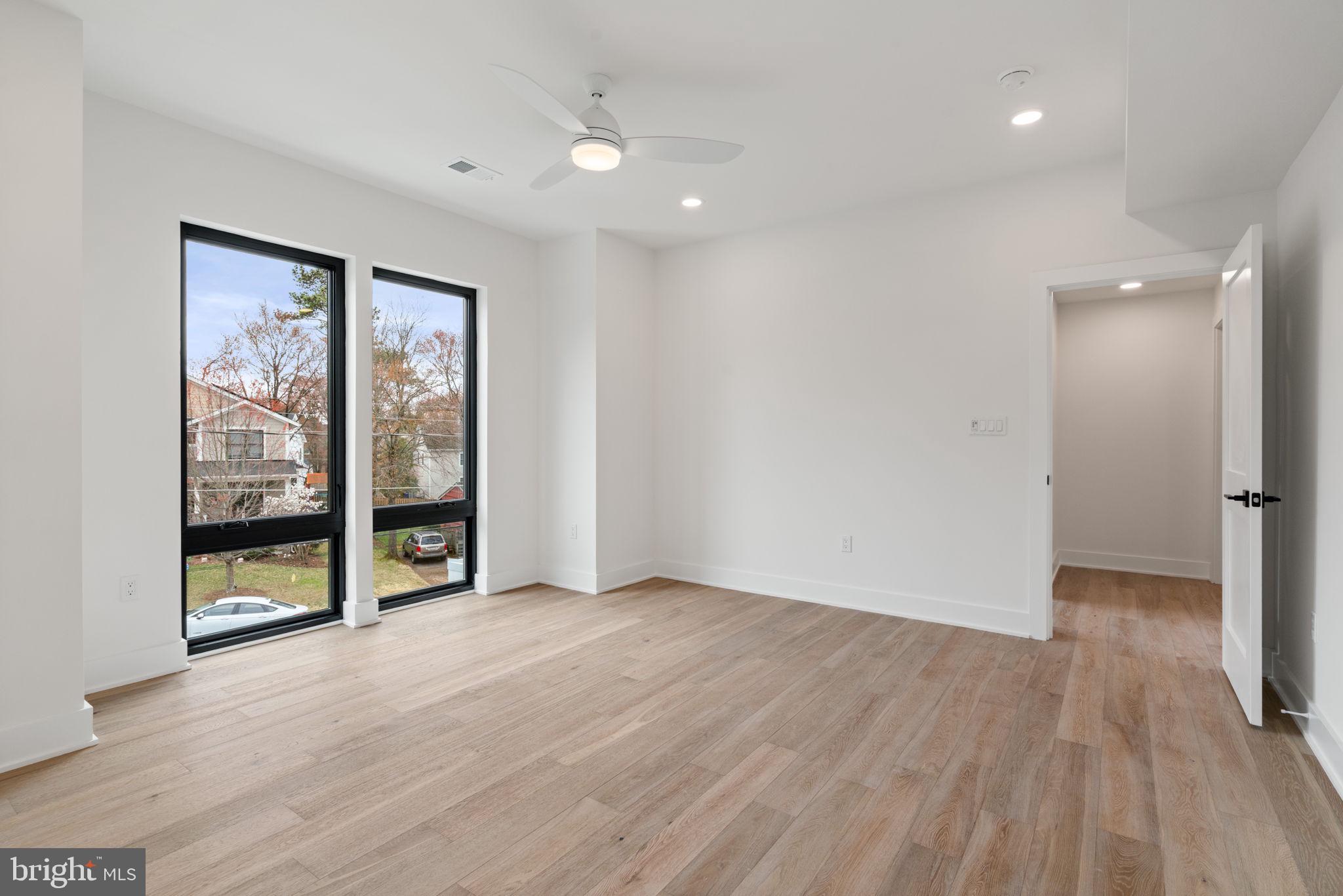 505 Adelman Circle Southwest Vienna, VA 22180 - Photo 53 of 85 wooden floor in an empty room with a window
