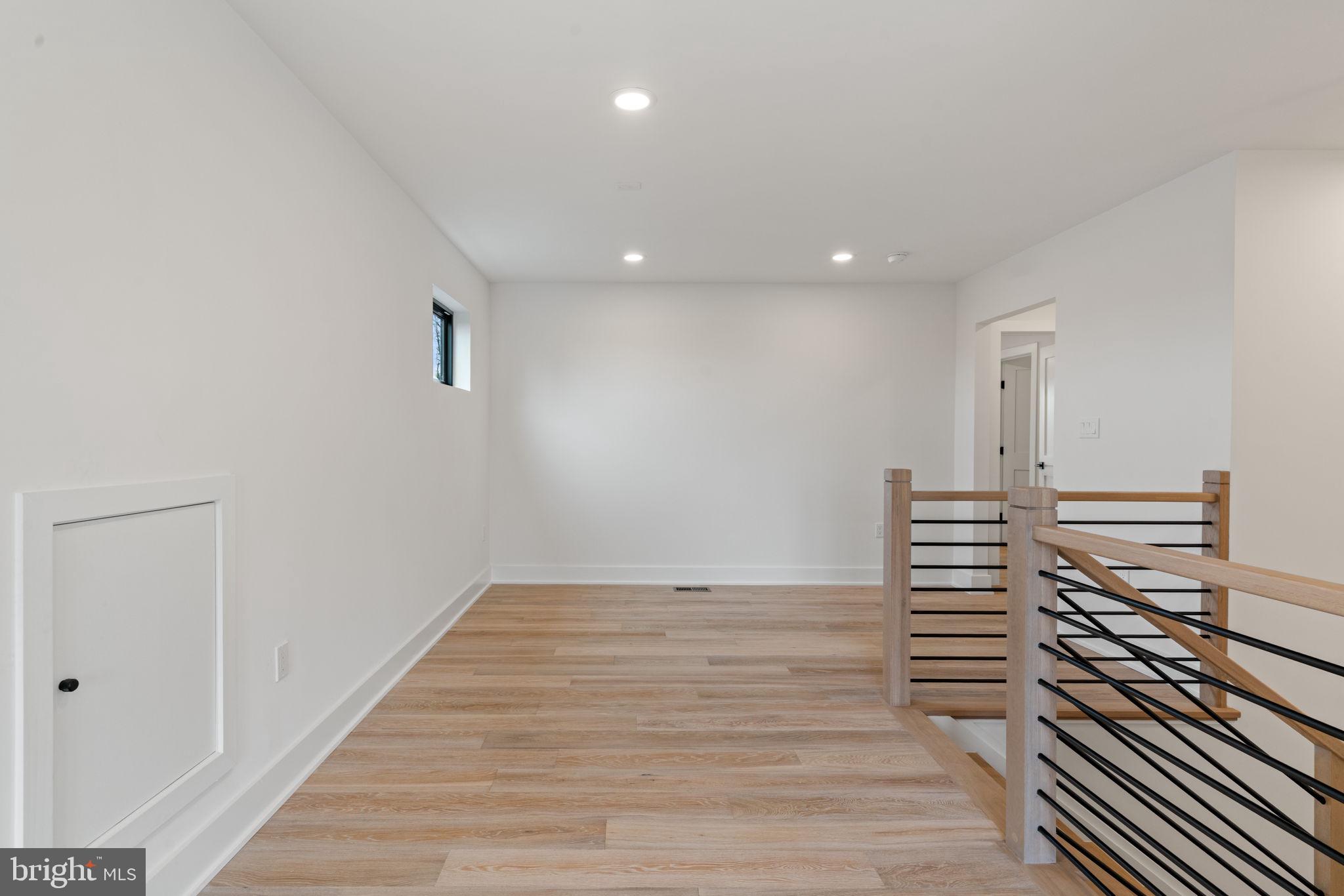 505 Adelman Circle Southwest Vienna, VA 22180 - Photo 63 of 85 a view of a hallway with wooden floor