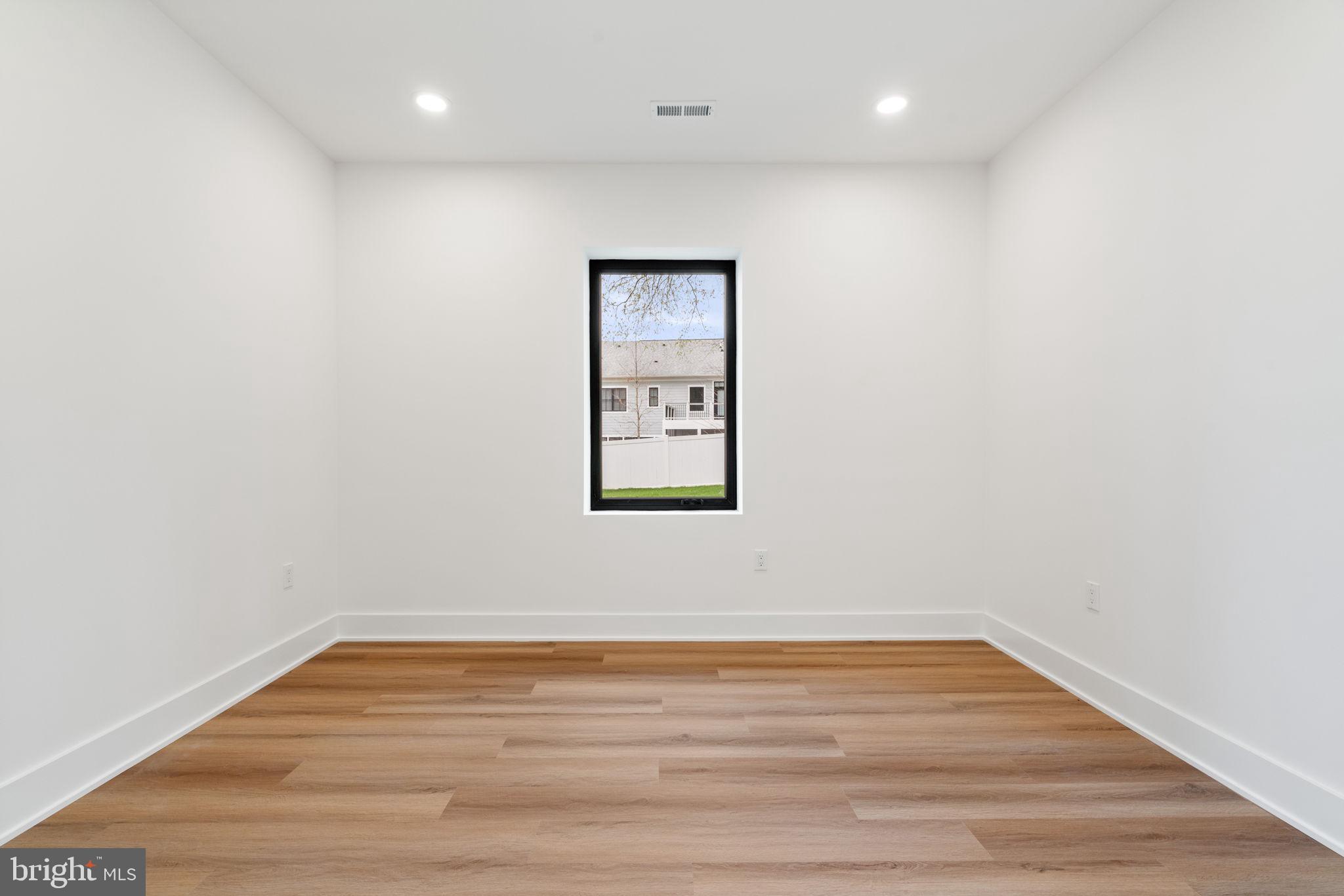 505 Adelman Circle Southwest Vienna, VA 22180 - Photo 72 of 85 a view of an empty room with wooden floor