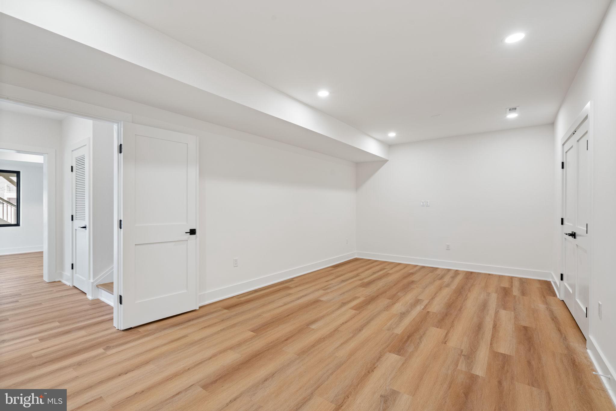 505 Adelman Circle Southwest Vienna, VA 22180 - Photo 74 of 85 wooden floor in an empty room with a window